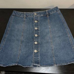 Jean mini skirt. Size 8. Back pockets (real pockets). Buttons straight up front.